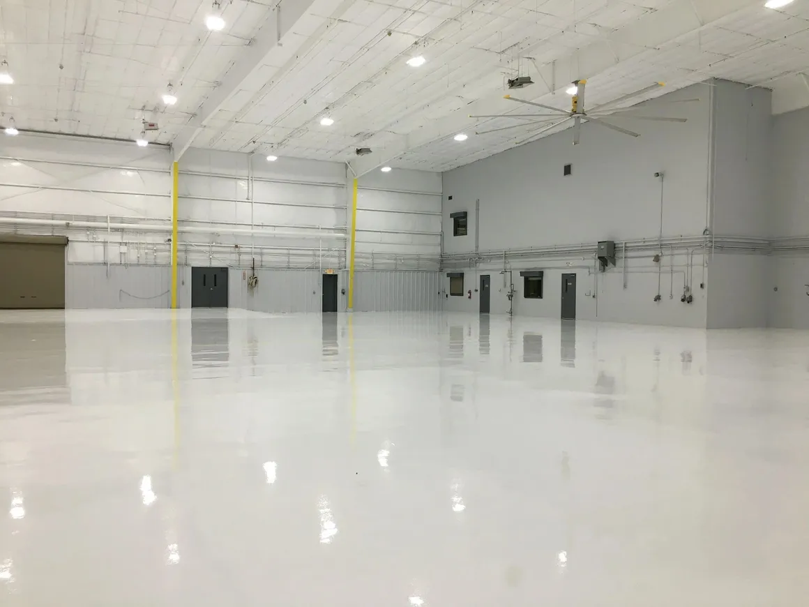 Epoxy and urethane flooring system in aircraft hangar high durability seamless floor